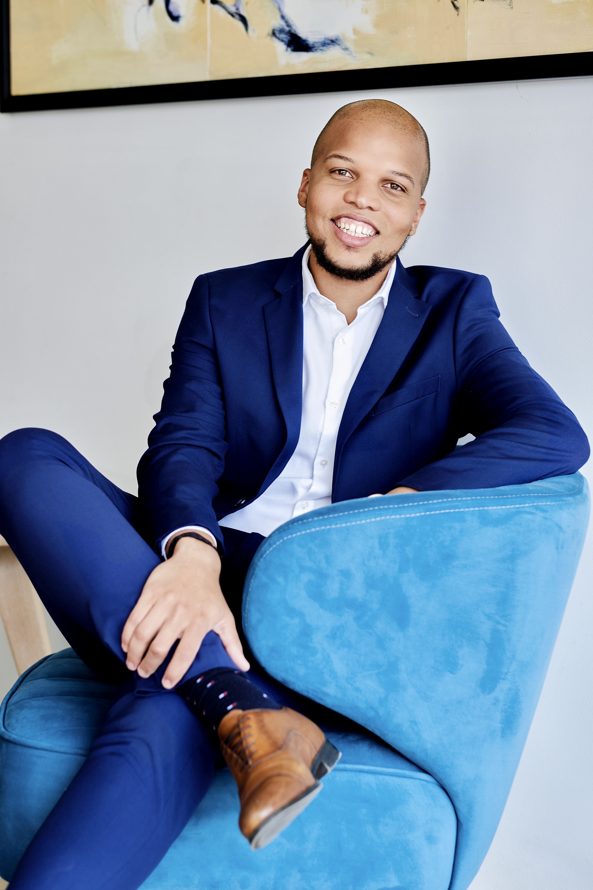 Vince Naar, lead consultant at Contivo Caribbean, seated in a navy suit